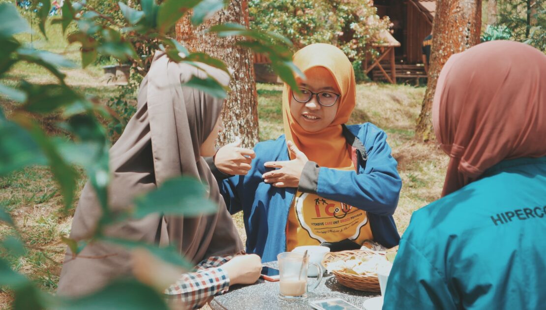 muslim young women talking to each other