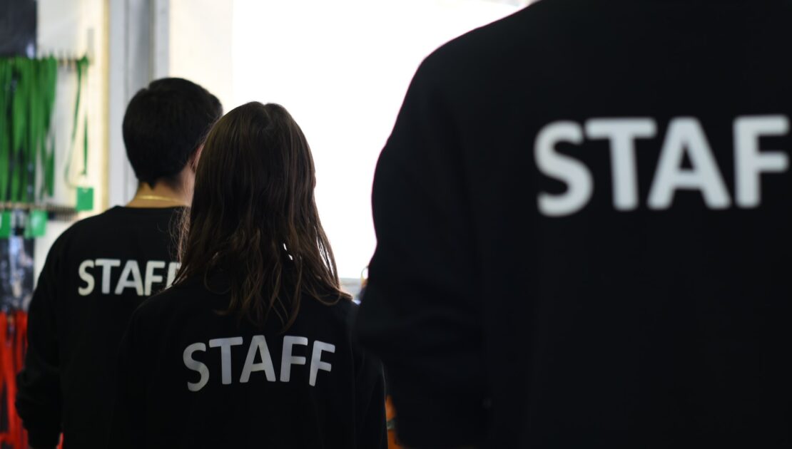 people in staff teashirts