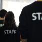 people in staff teashirts